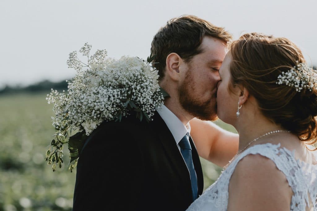 North Gower Backyard Wedding - bride and groom kiss