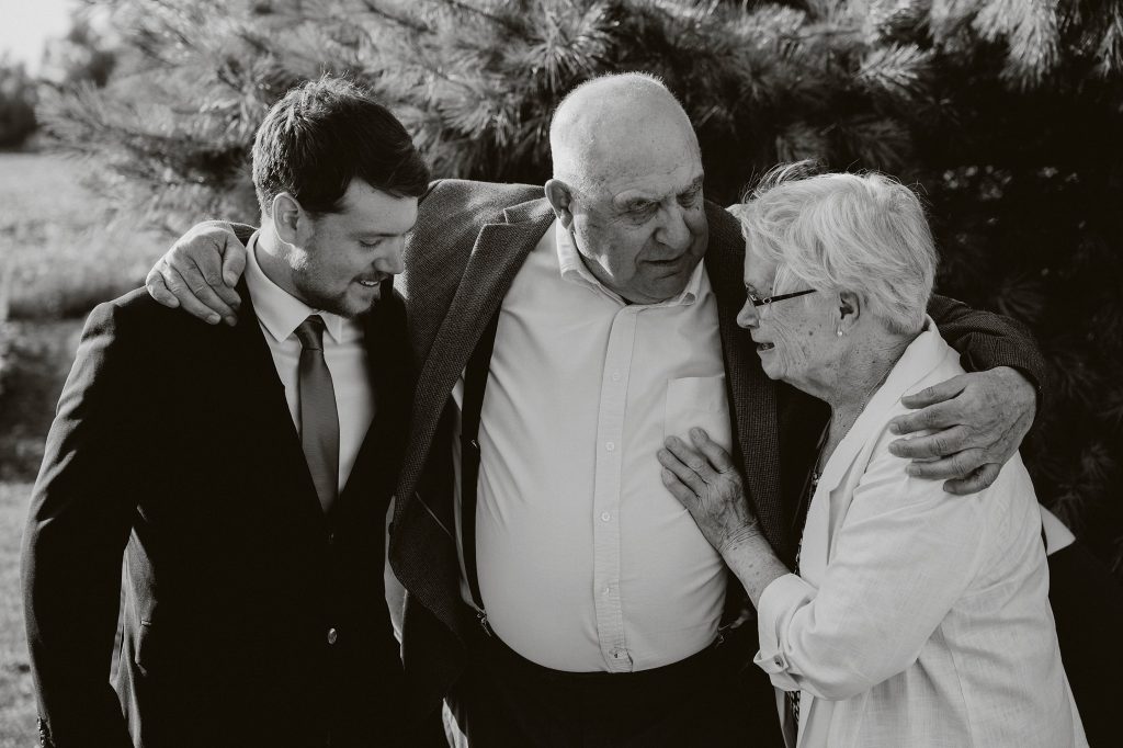 North Gower Backyard Wedding - groom and grandparents hug