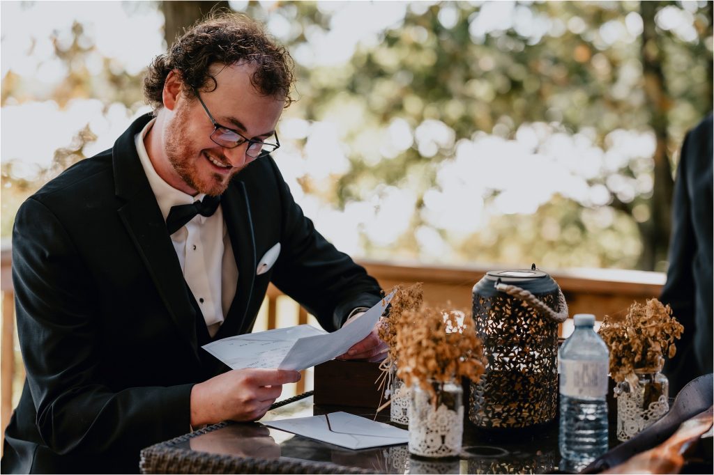 Groom reading a letter from the bride