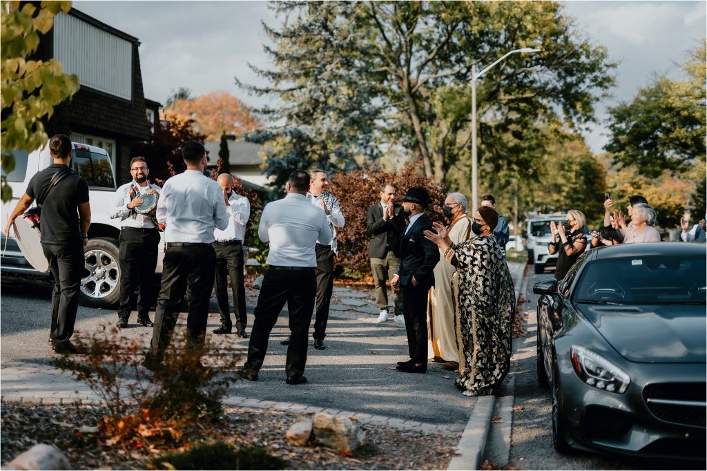 Groom and his parents follow an Algerian Band to bride's house
