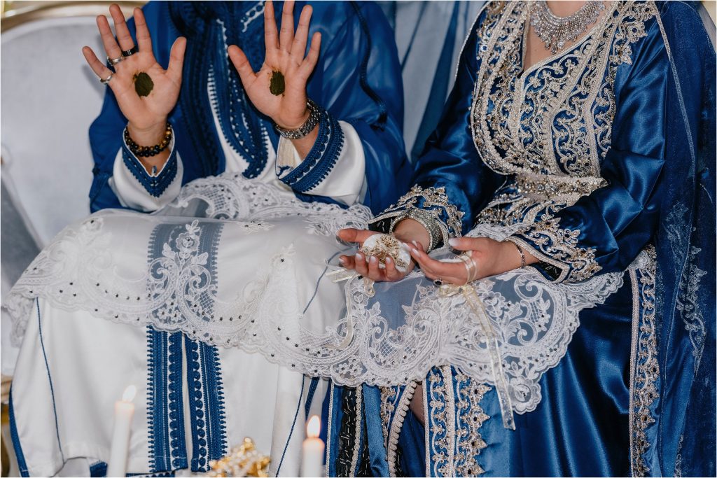 Henna on bride and groom's hands during their wedding reception