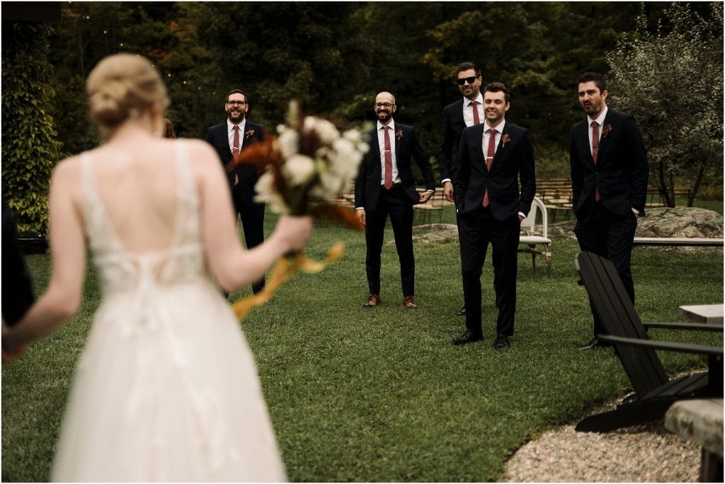 groomsmen seeing the bride for the first time