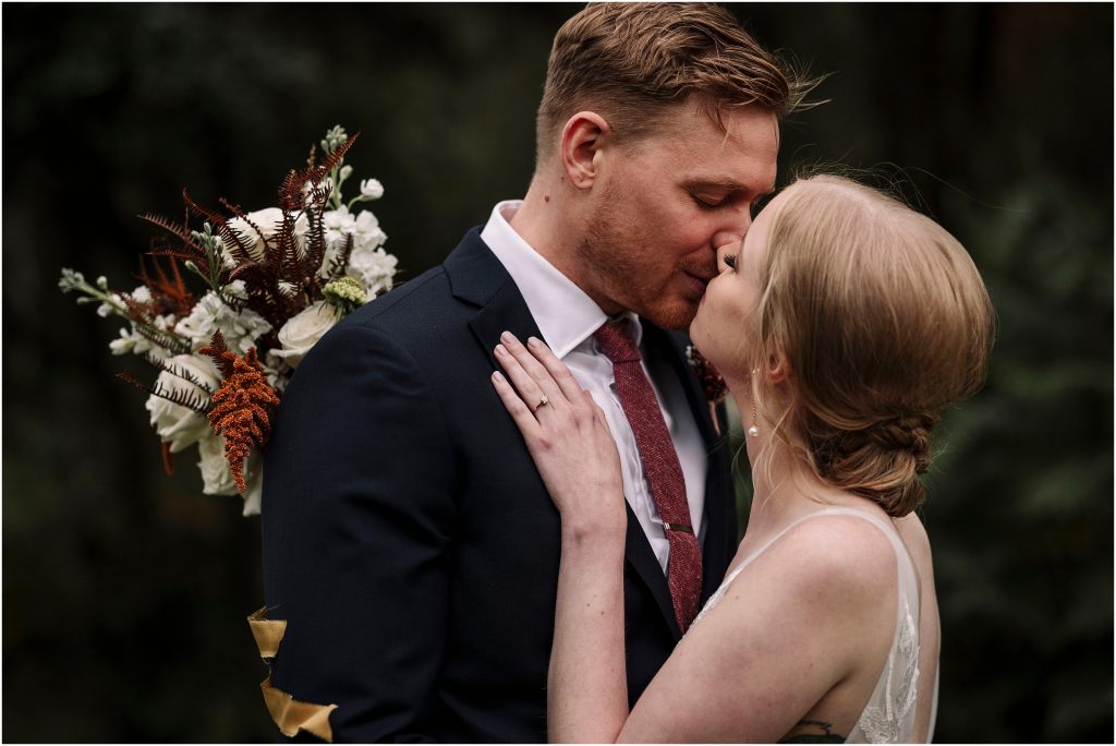 passionate kiss at a fall wedding at Adelina