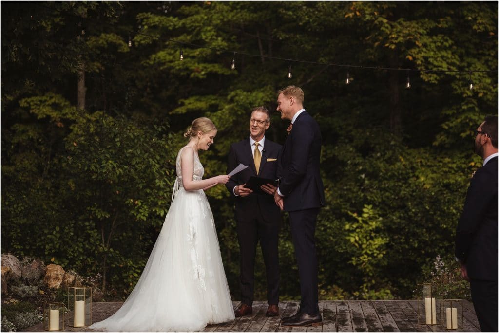 exchanging vows at an outdoor wedding ceremony