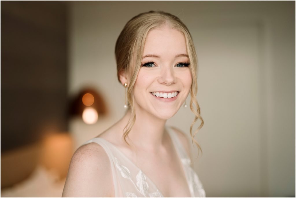 a portrait of a bride smiling on her wedding day