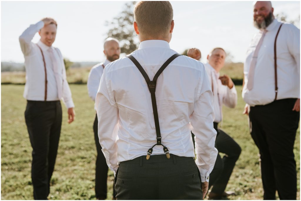 Custom suspenders for this country wedding groom. Photo by Cindy Lottes Photography