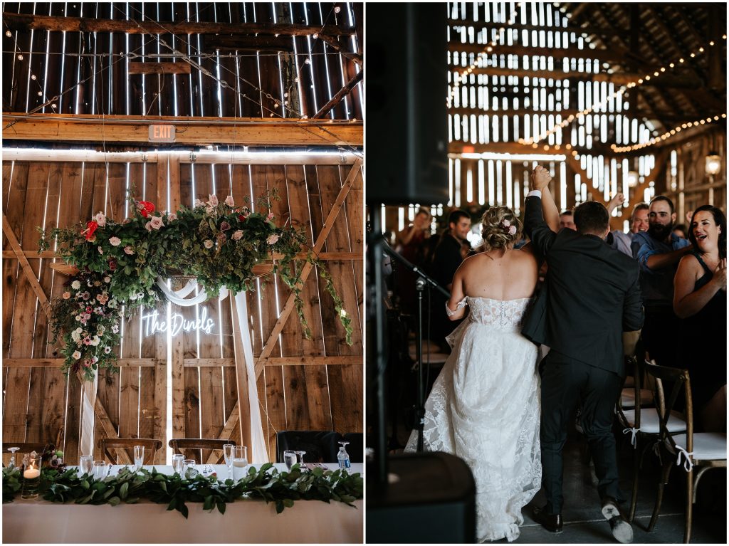 Guests welcome the newlyweds into the barn reception